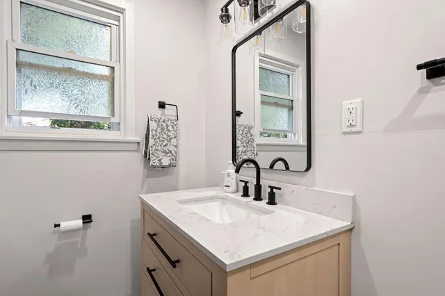 a bathroom with a sink and a mirror