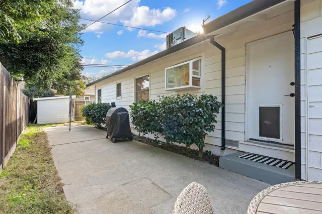 a view of a house with couches in front of house