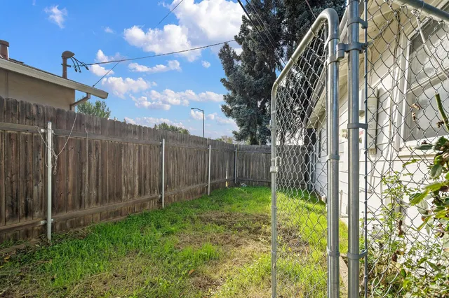 a view of backyard with green space