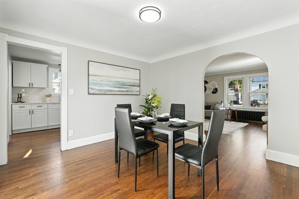 706 Allen Street Springfield, MA 01118 - Photo 11 of 33 a view of a dining room with furniture and wooden floor
