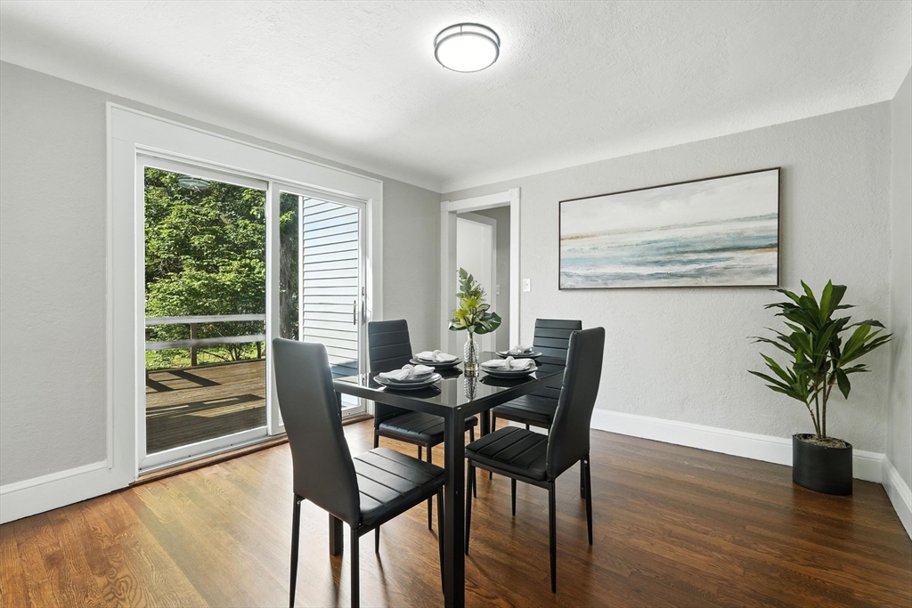 706 Allen Street Springfield, MA 01118 - Photo 12 of 33 a view of a dining room with furniture and a potted plant
