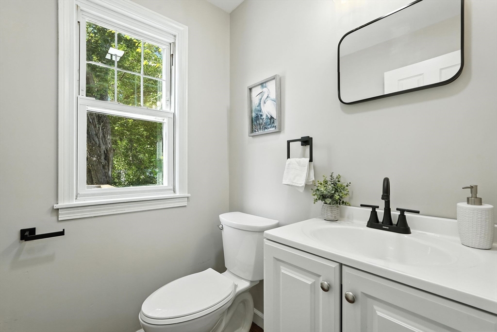 706 Allen Street Springfield, MA 01118 - Photo 16 of 33 a bathroom with a sink a toilet and a mirror
