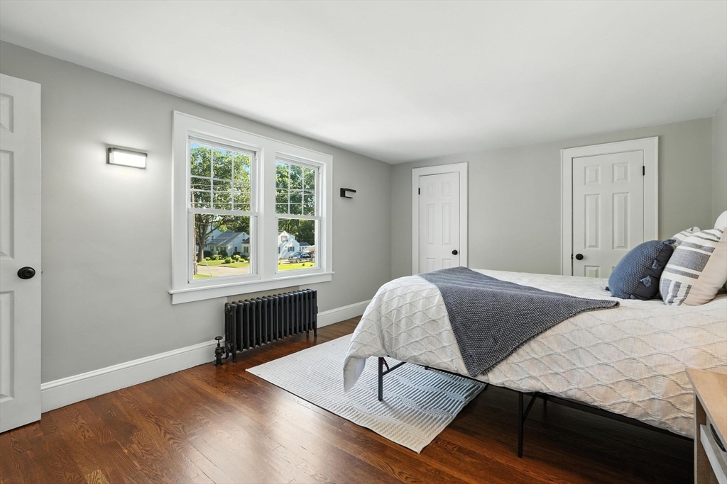 706 Allen Street Springfield, MA 01118 - Photo 19 of 33 a bedroom with a bed and a window