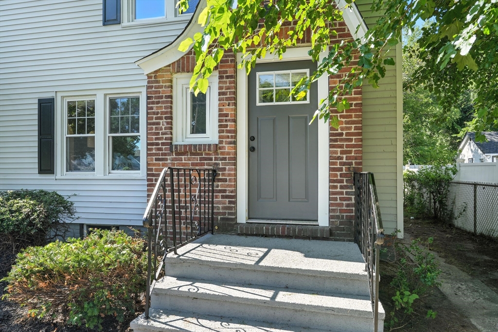 706 Allen Street Springfield, MA 01118 - Photo 2 of 33 a view of a brick house with a door and wooden floor