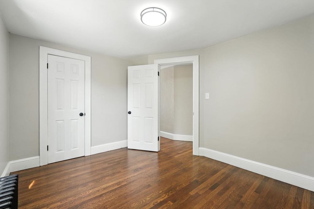 706 Allen Street Springfield, MA 01118 - Photo 26 of 33 a view of an empty room with wooden floor