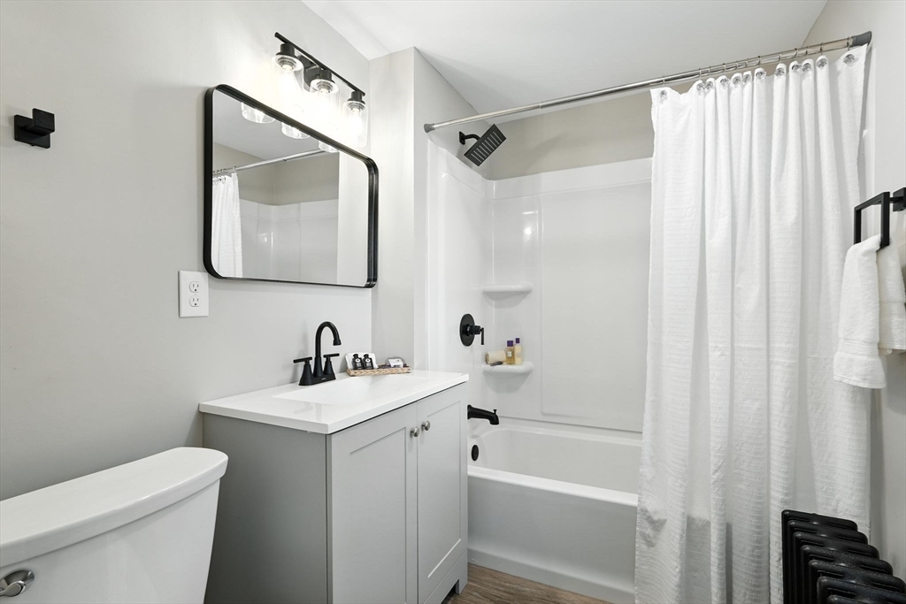 706 Allen Street Springfield, MA 01118 - Photo 27 of 33 a bathroom with a sink toilet and shower