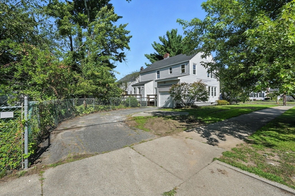 706 Allen Street Springfield, MA 01118 - Photo 33 of 33 front view of a house with a yard