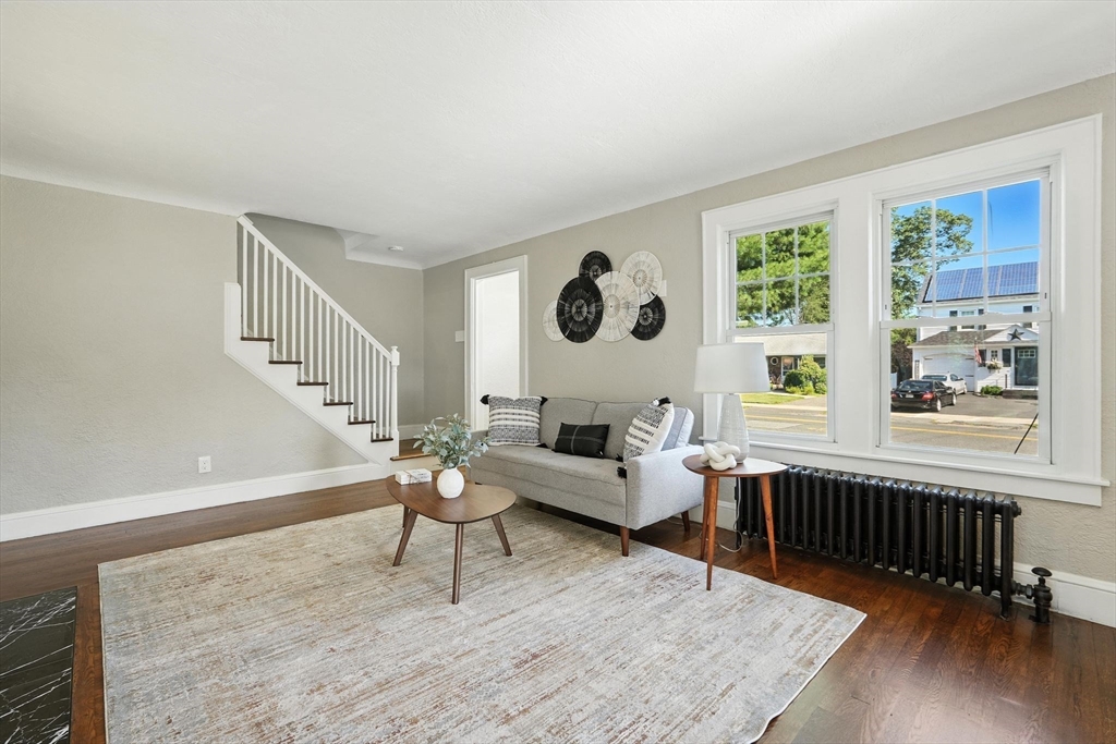 706 Allen Street Springfield, MA 01118 - Photo 7 of 33 a living room with furniture and a window