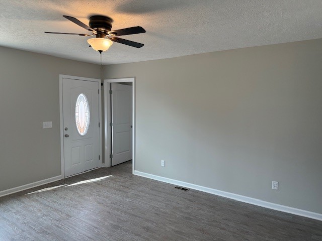 3336 Oak Grove Road Decherd, TN 37324 - Photo 12 of 21 an empty room with wooden floor and windows