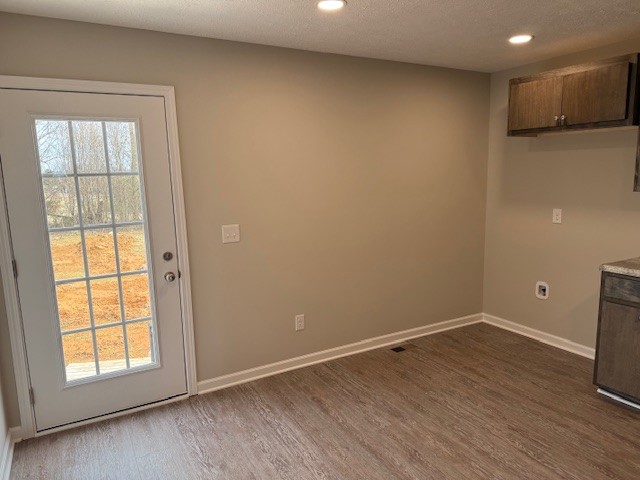 3336 Oak Grove Road Decherd, TN 37324 - Photo 13 of 21 an empty room with wooden floor and windows