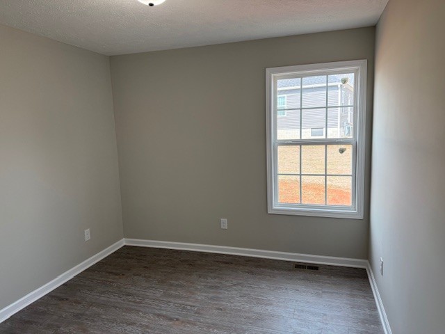 3336 Oak Grove Road Decherd, TN 37324 - Photo 16 of 21 an empty room with wooden floor and windows