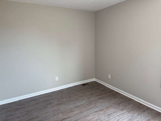 3336 Oak Grove Road Decherd, TN 37324 - Photo 18 of 21 a view of an empty room with wooden floor