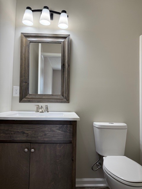 3336 Oak Grove Road Decherd, TN 37324 - Photo 19 of 21 a bathroom with a toilet sink and mirror