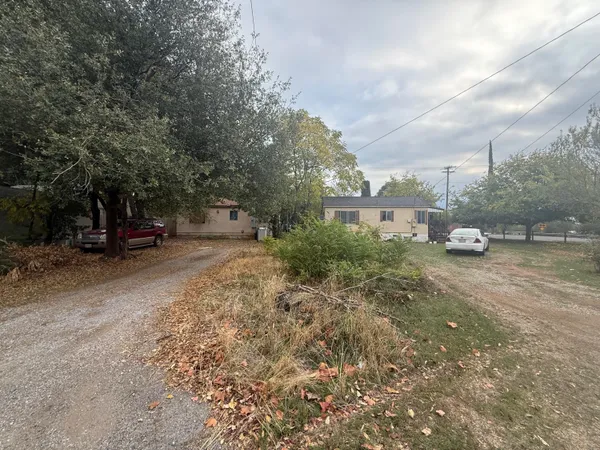 a view of outdoor space with playground and green space