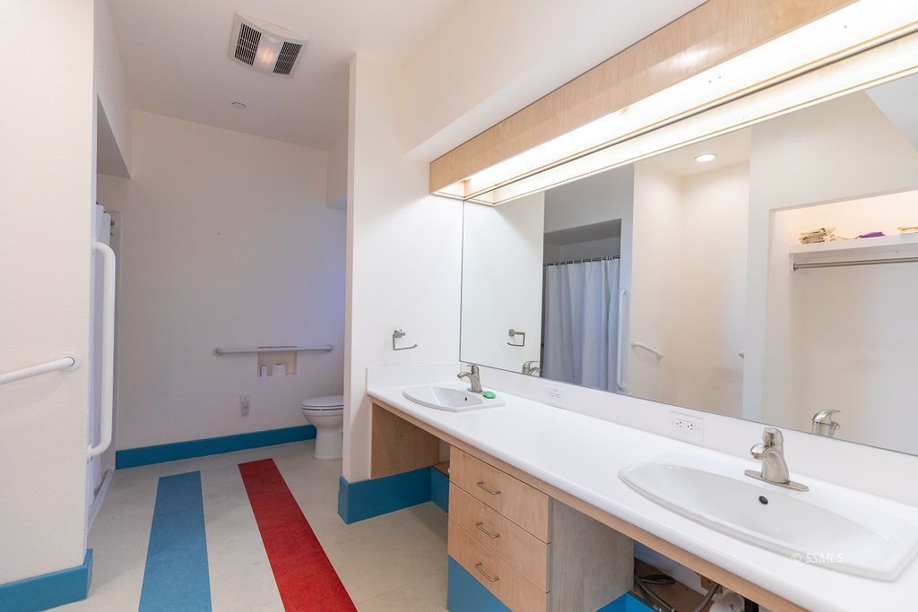 1325 Dunes Street Ridgecrest, CA 93555 - Photo 34 of 50 a bathroom with a sink and a mirror