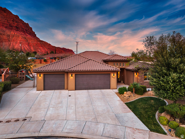 210 Talon Court Ivins, UT 84738 - Photo 2 of 60 Mediterranean / spanish-style house featuring a garage, stucco siding, driveway, and a tiled roof
