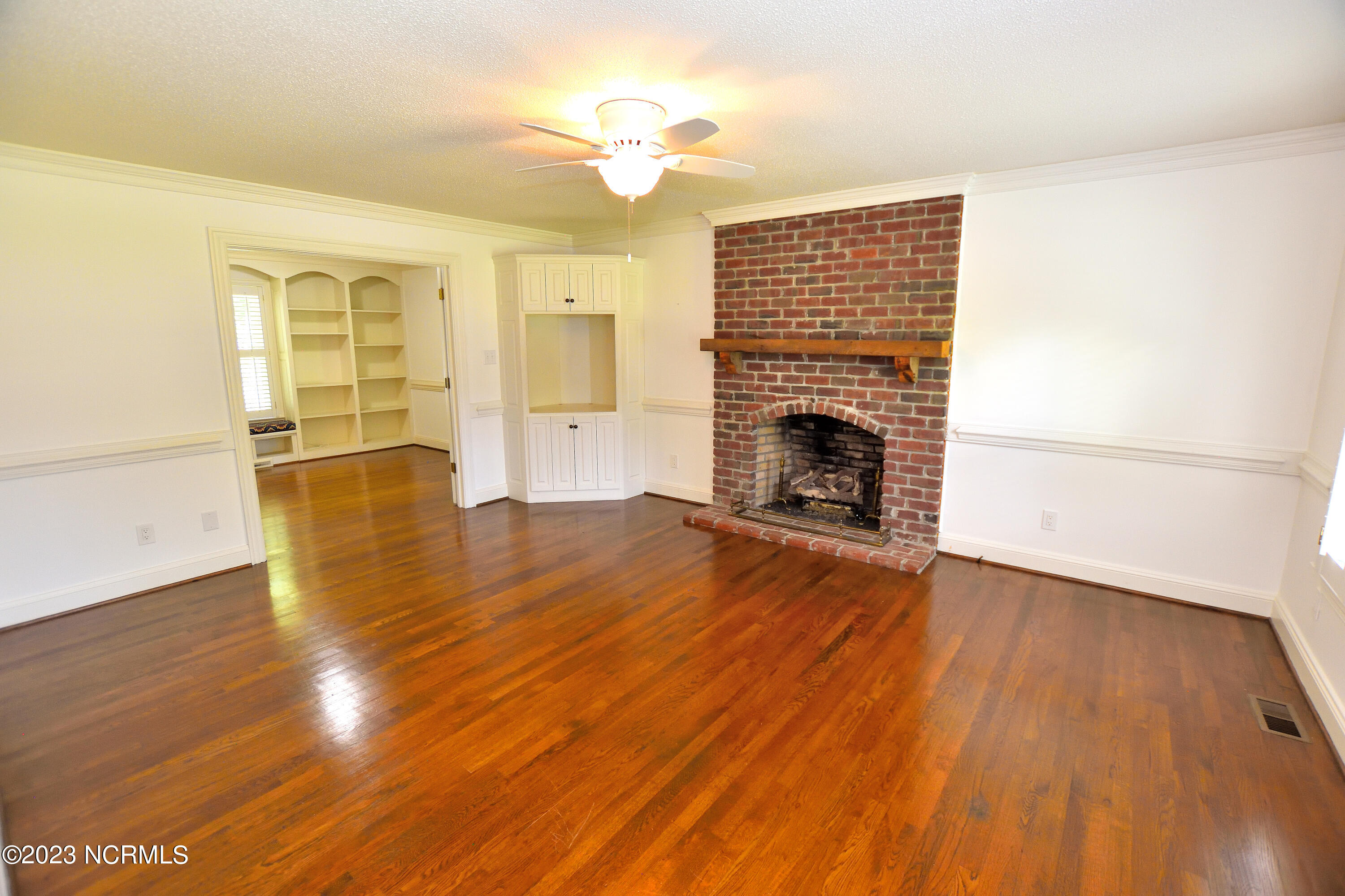 4012 Gloucester Road Rocky Mount, NC 27803 - Photo 11 of 38 Brick Fireplace and custom built-ins