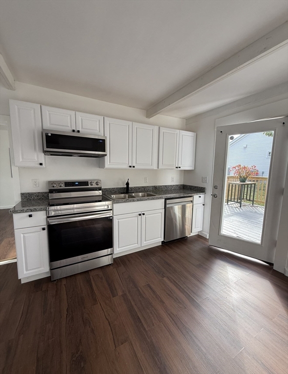 193 Freedom Street Athol, MA 01331 - Photo 9 of 37 a kitchen with granite countertop a stove a sink and a microwave