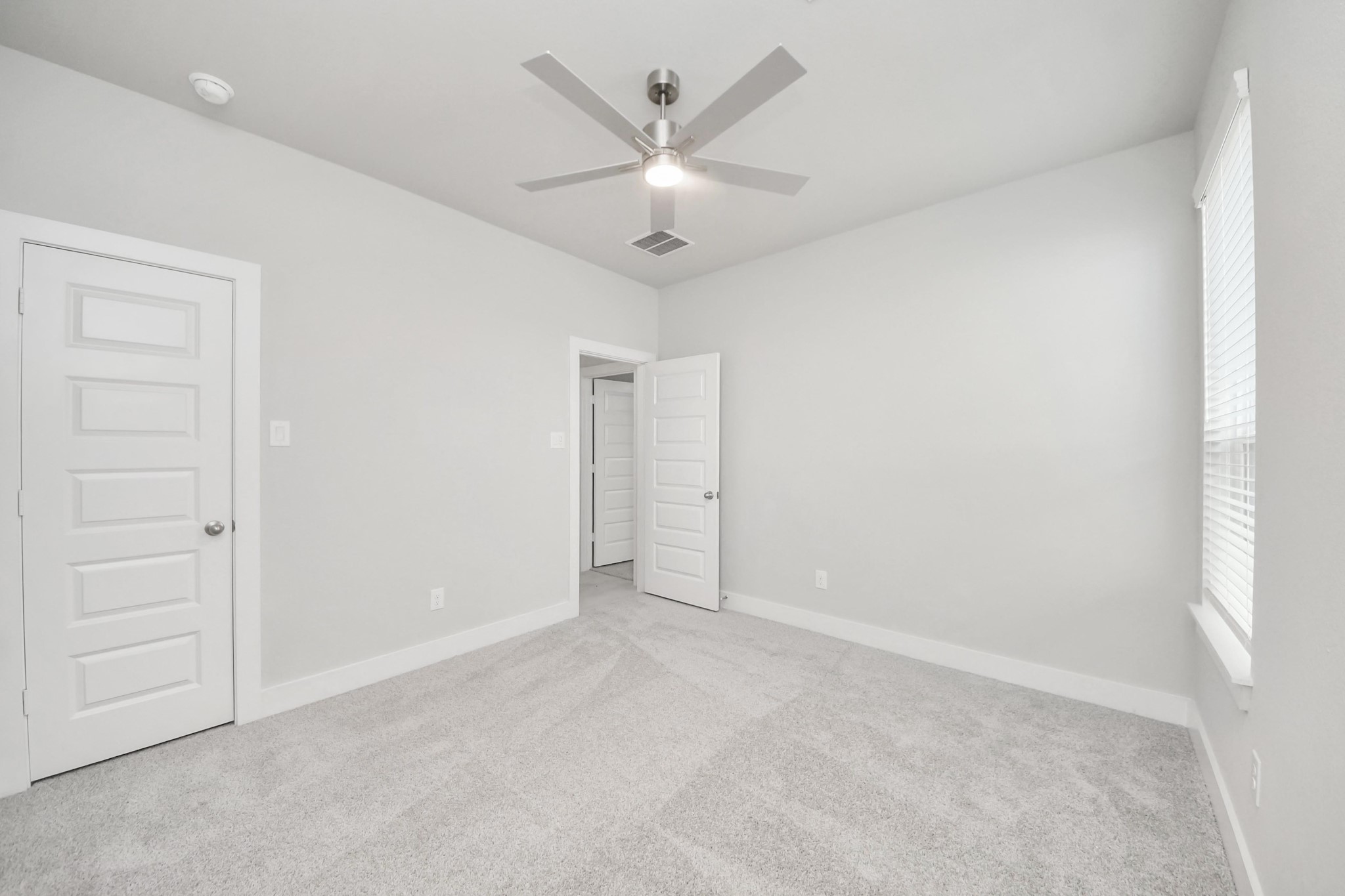 3042 Native Spg Drive Spring, TX 77373 - Photo 8 of 32 Generously sized secondary bedrooms featuring spacious closets, soft and inviting carpeting underfoot, large windows allowing plenty of natural light, and the added touch of privacy blinds for your personal retreat. Sample photo of completed home with similar floor plan. Actual colors and selections may vary.