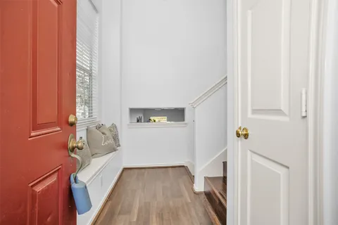 a view of bedroom with furniture and staircase