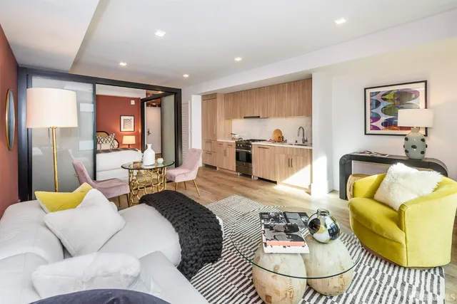 a living room with furniture and a table