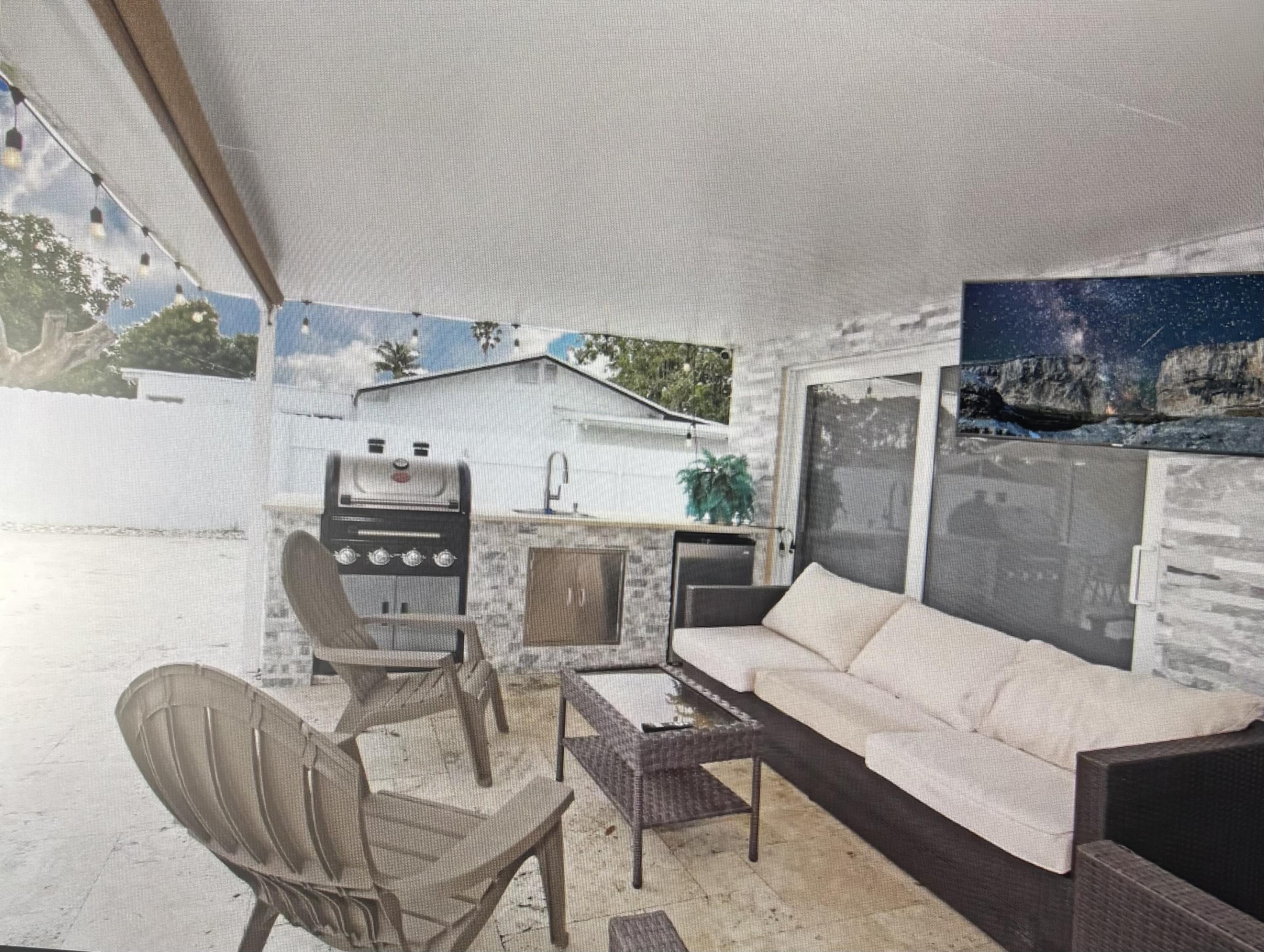 124 Davis Road Palm Springs, FL 33461 - Photo 13 of 29 Kitchen patio