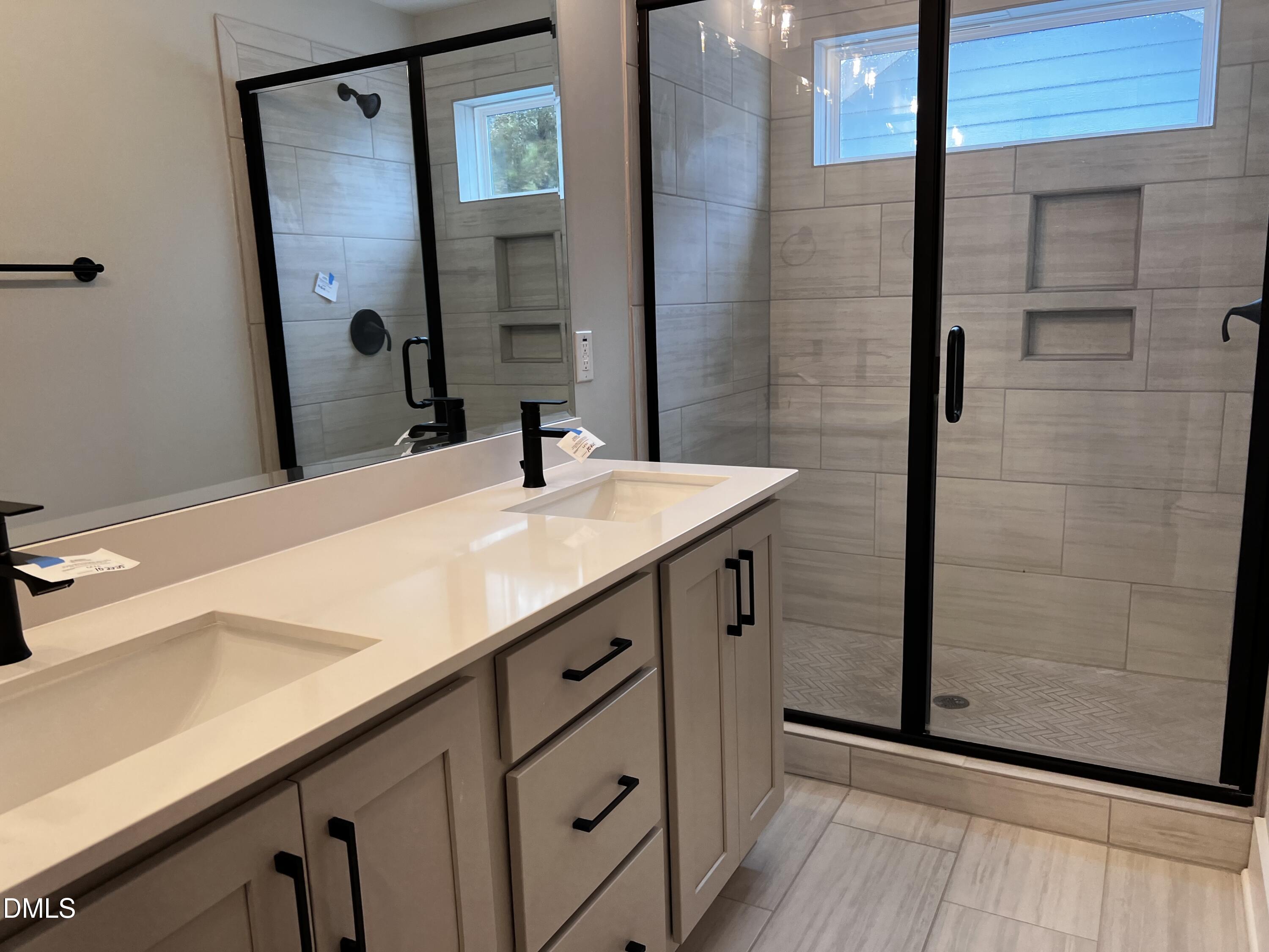 1439 Garner Road Raleigh, NC 27610 - Photo 11 of 28 a bathroom with a sink and a mirror