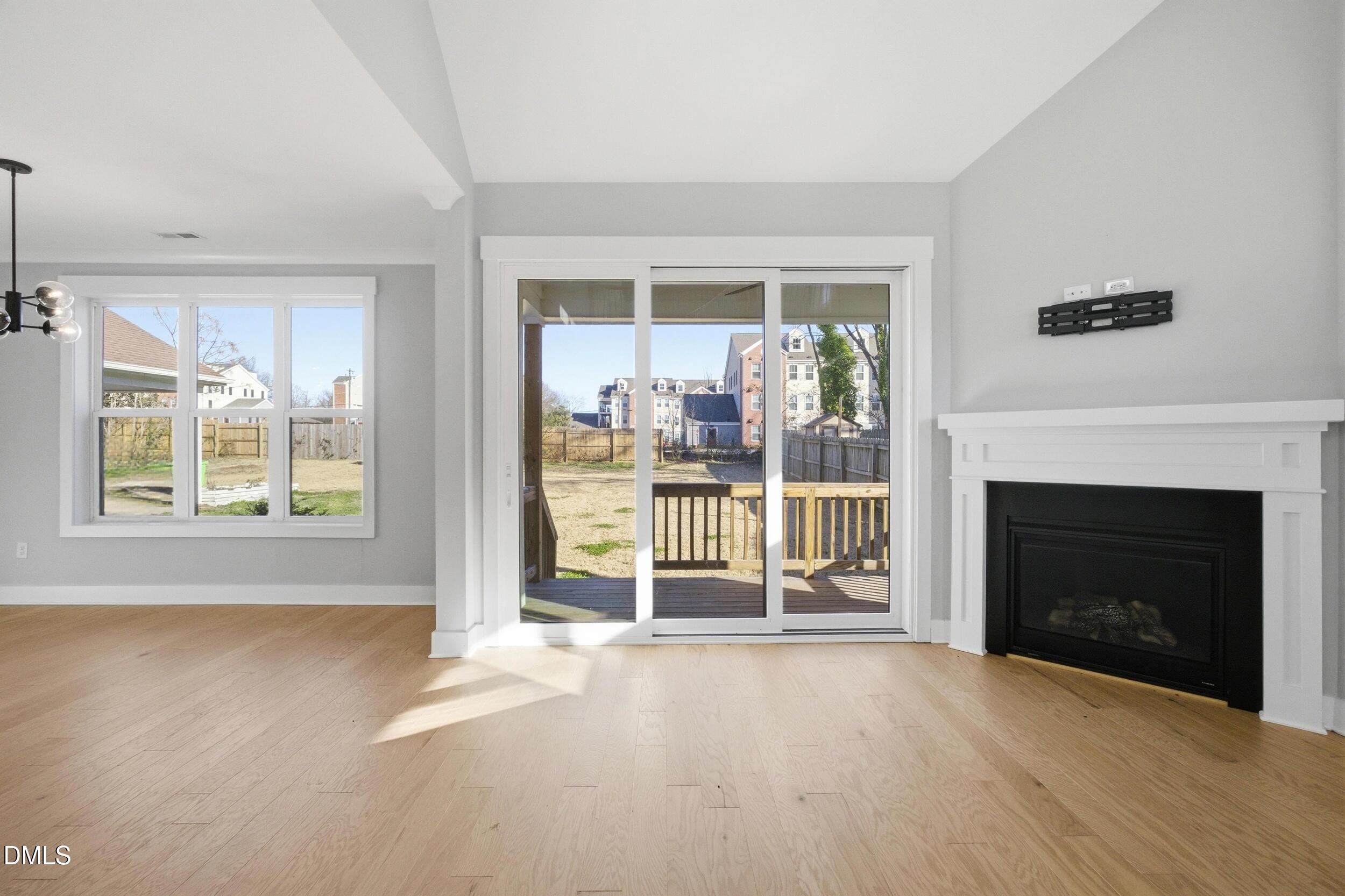 1439 Garner Road Raleigh, NC 27610 - Photo 12 of 37 a view of a livingroom with a fireplace and window