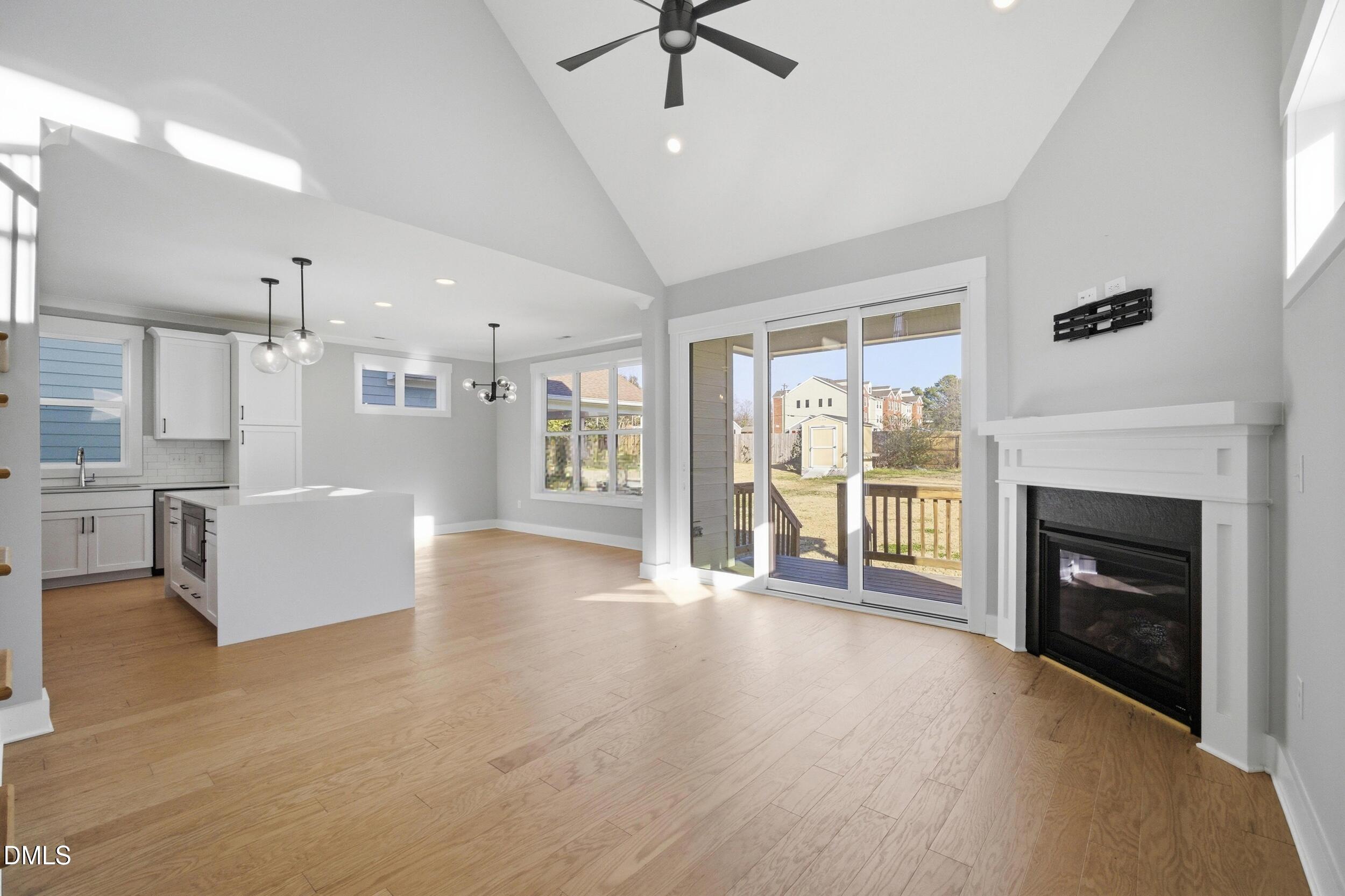 1439 Garner Road Raleigh, NC 27610 - Photo 13 of 37 a view of an empty room with a fireplace and a window