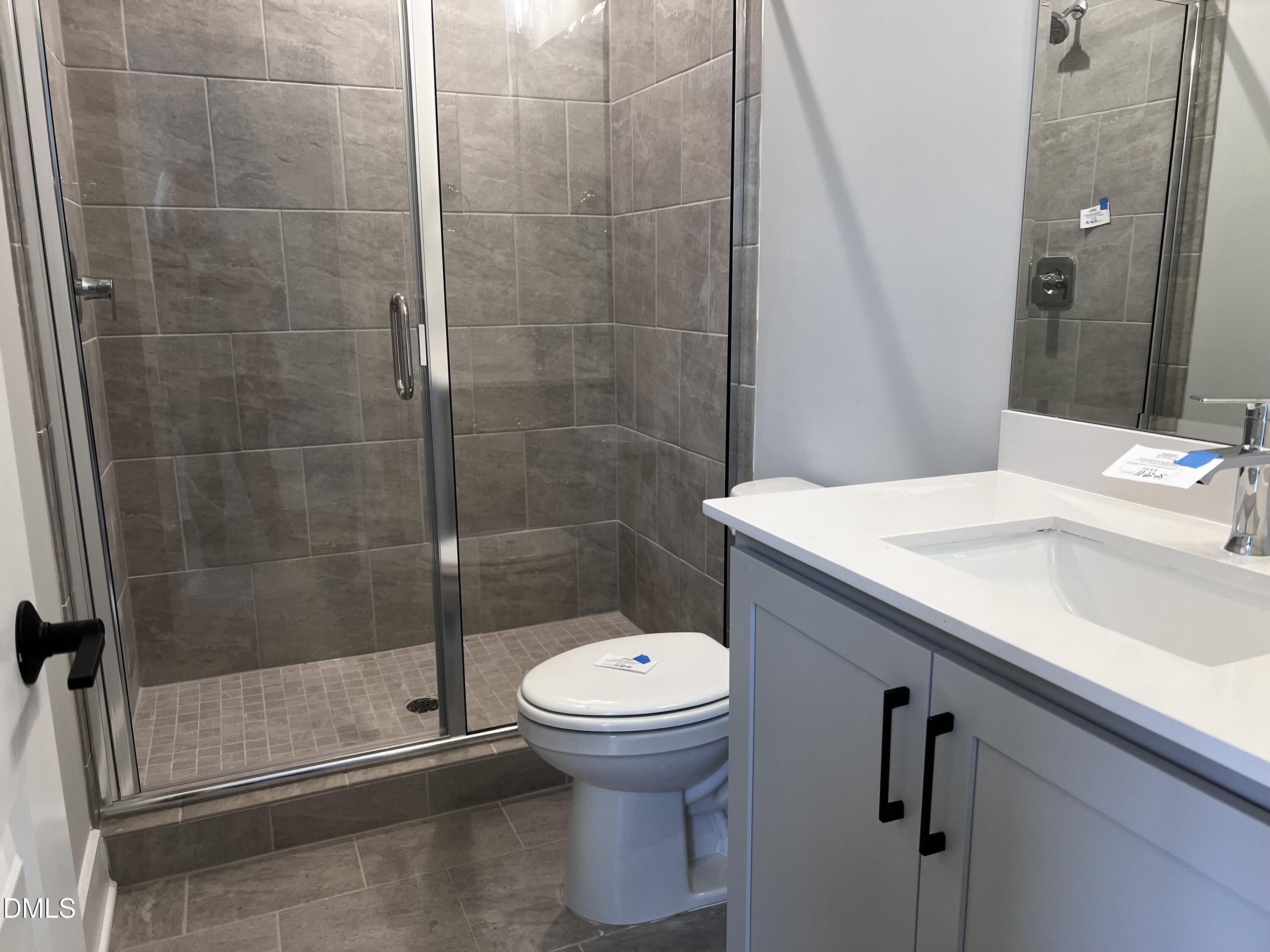 1439 Garner Road Raleigh, NC 27610 - Photo 14 of 28 a bathroom with a sink toilet and shower