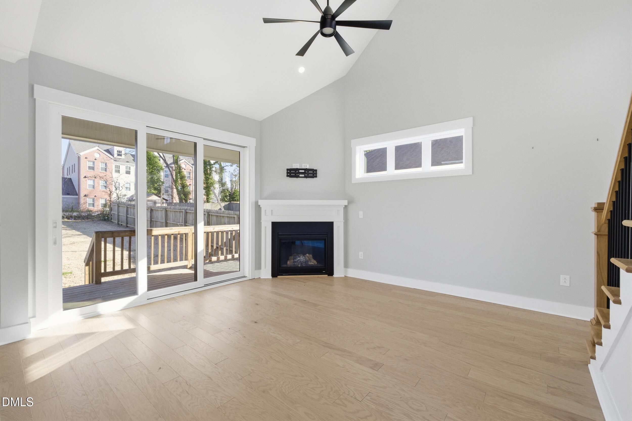 1439 Garner Road Raleigh, NC 27610 - Photo 14 of 37 a view of a livingroom with an empty space and a fireplace