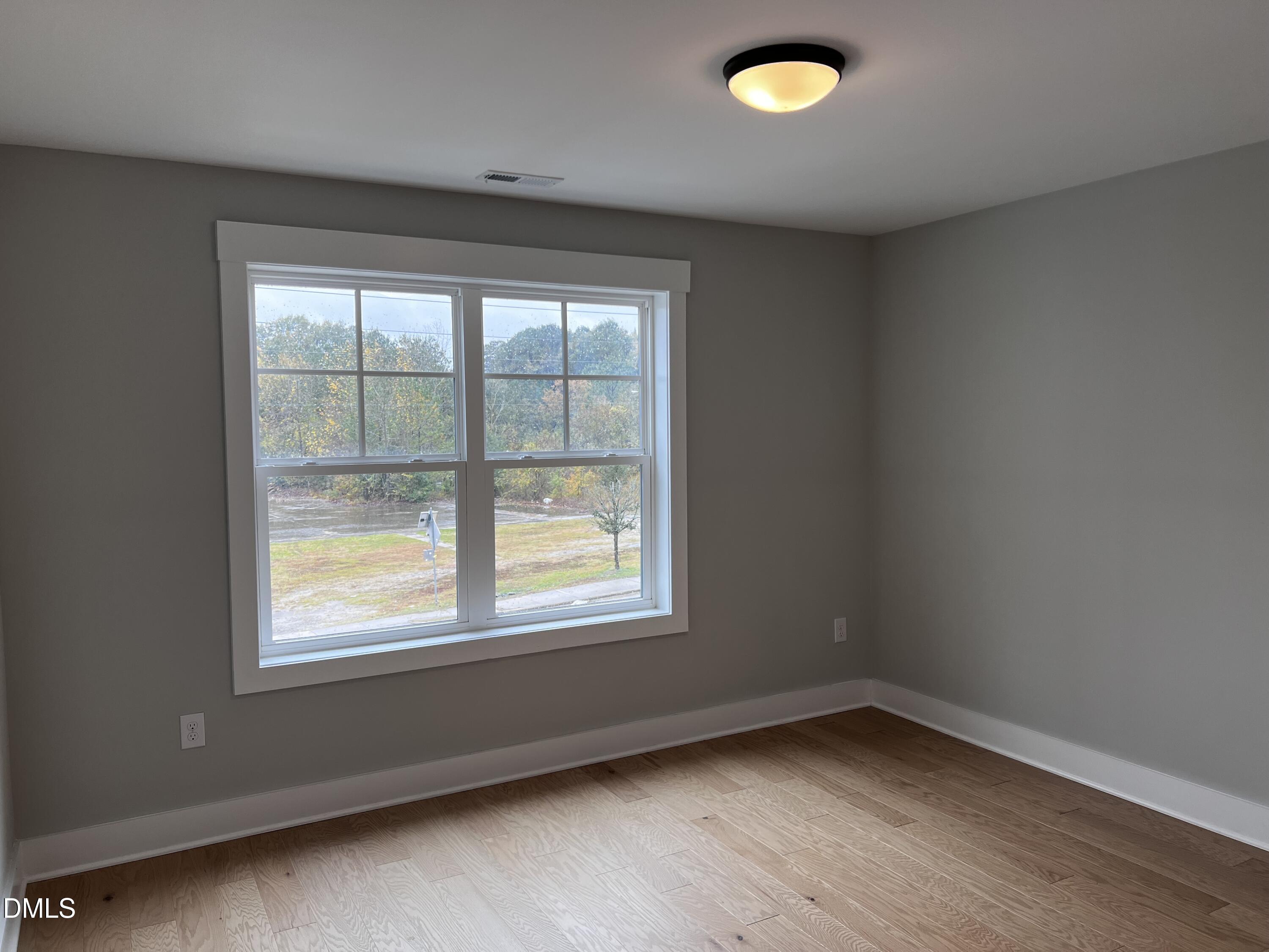 1439 Garner Road Raleigh, NC 27610 - Photo 15 of 28 an empty room with a window