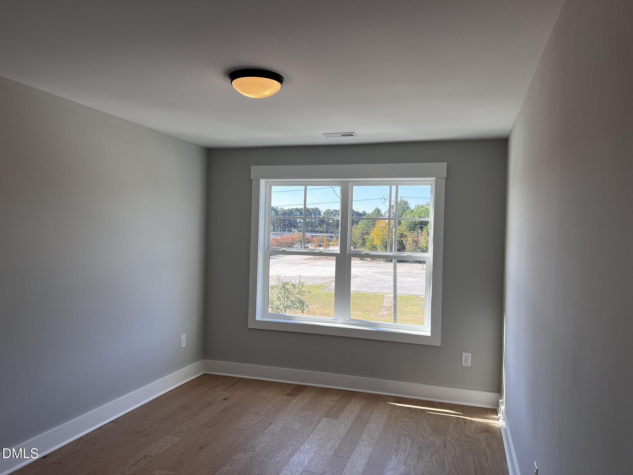 1439 Garner Road Raleigh, NC 27610 - Photo 16 of 28 an empty room with a window