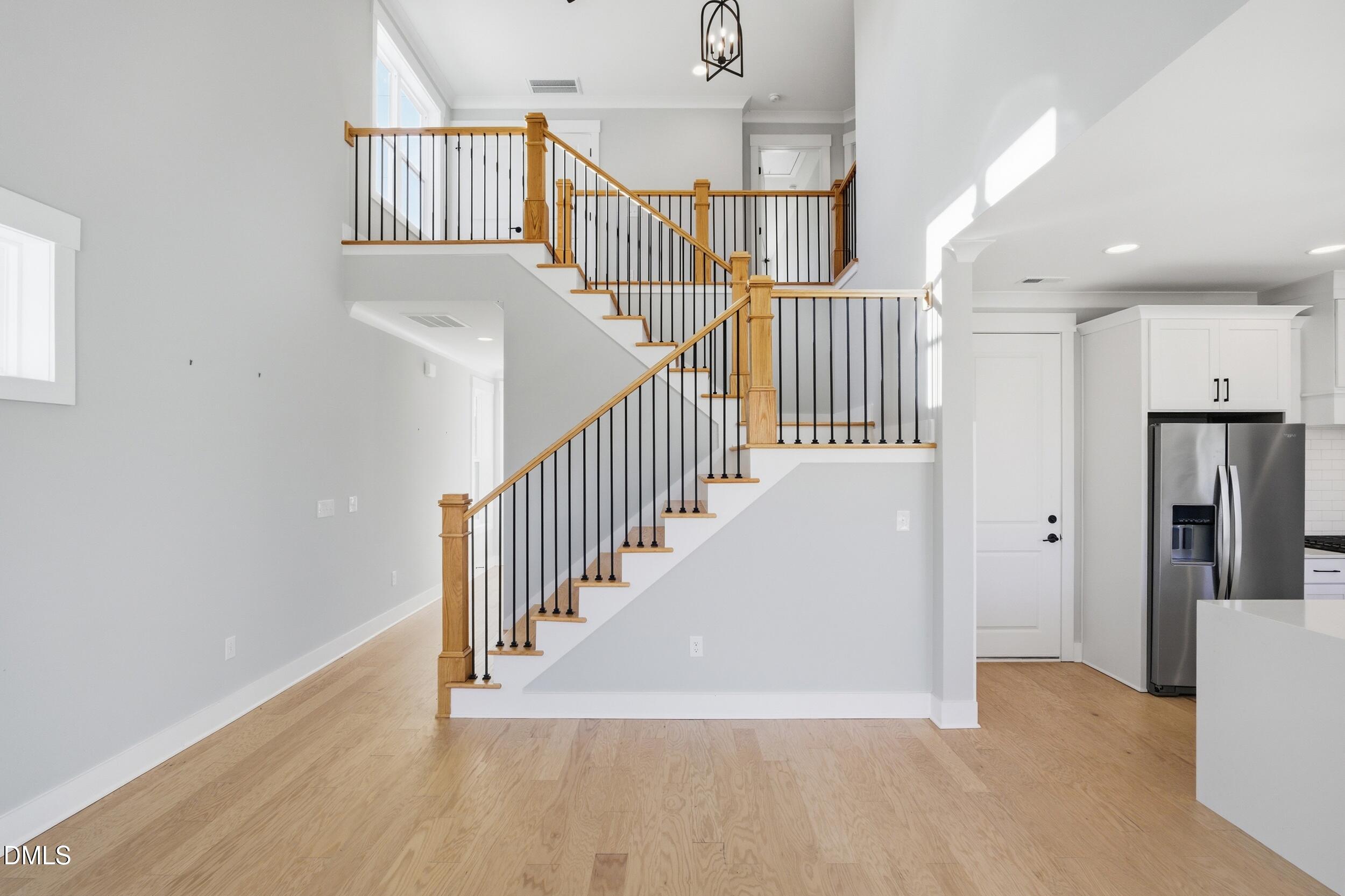 1439 Garner Road Raleigh, NC 27610 - Photo 18 of 37 a view of entryway and hall with wooden floor