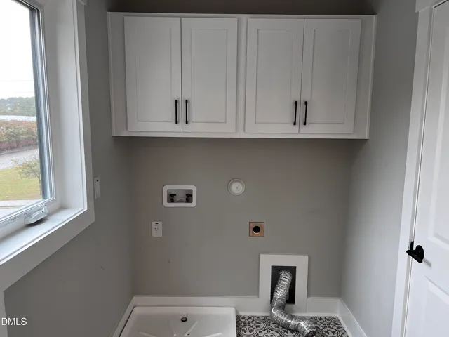 a close view of a closet in the white cabinet and a window
