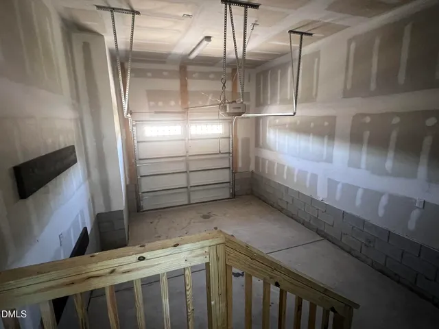 a kitchen with cabinets and a wooden floor