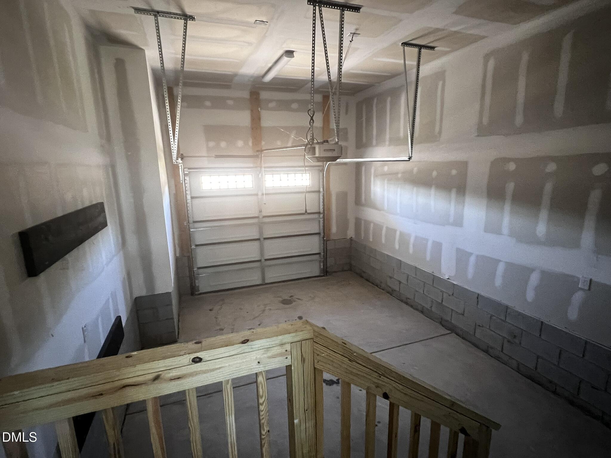 1439 Garner Road Raleigh, NC 27610 - Photo 19 of 28 a kitchen with cabinets and a wooden floor