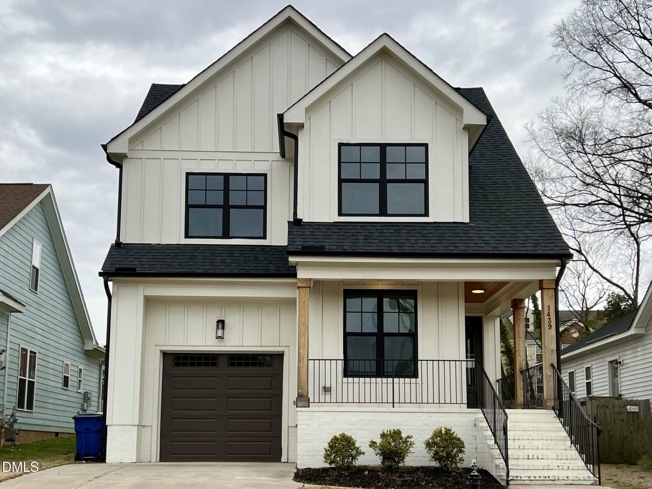 1439 Garner Road Raleigh, NC 27610 - Photo 2 of 37 a front view of a house with a garage