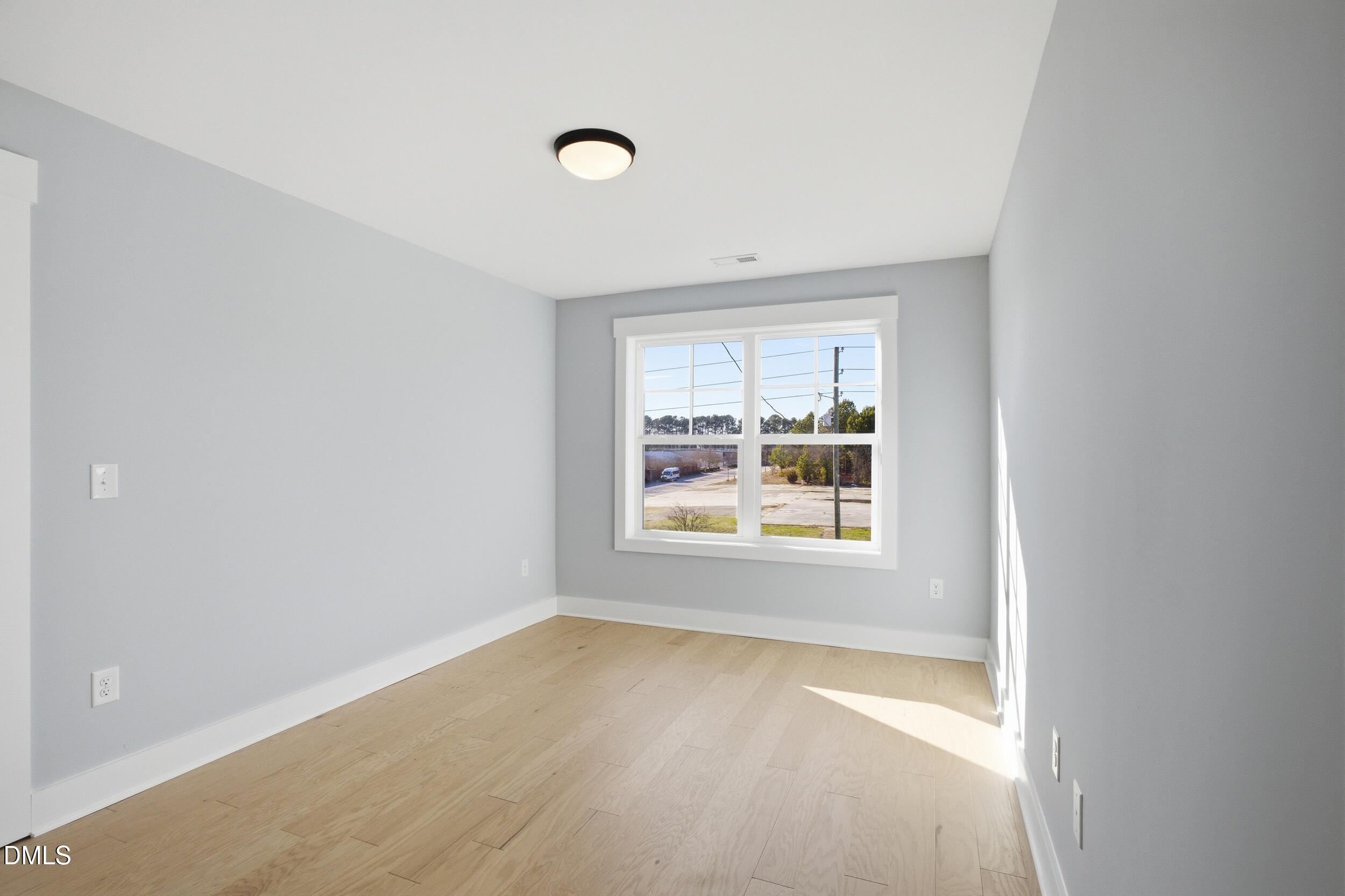 1439 Garner Road Raleigh, NC 27610 - Photo 23 of 37 an empty room with a window