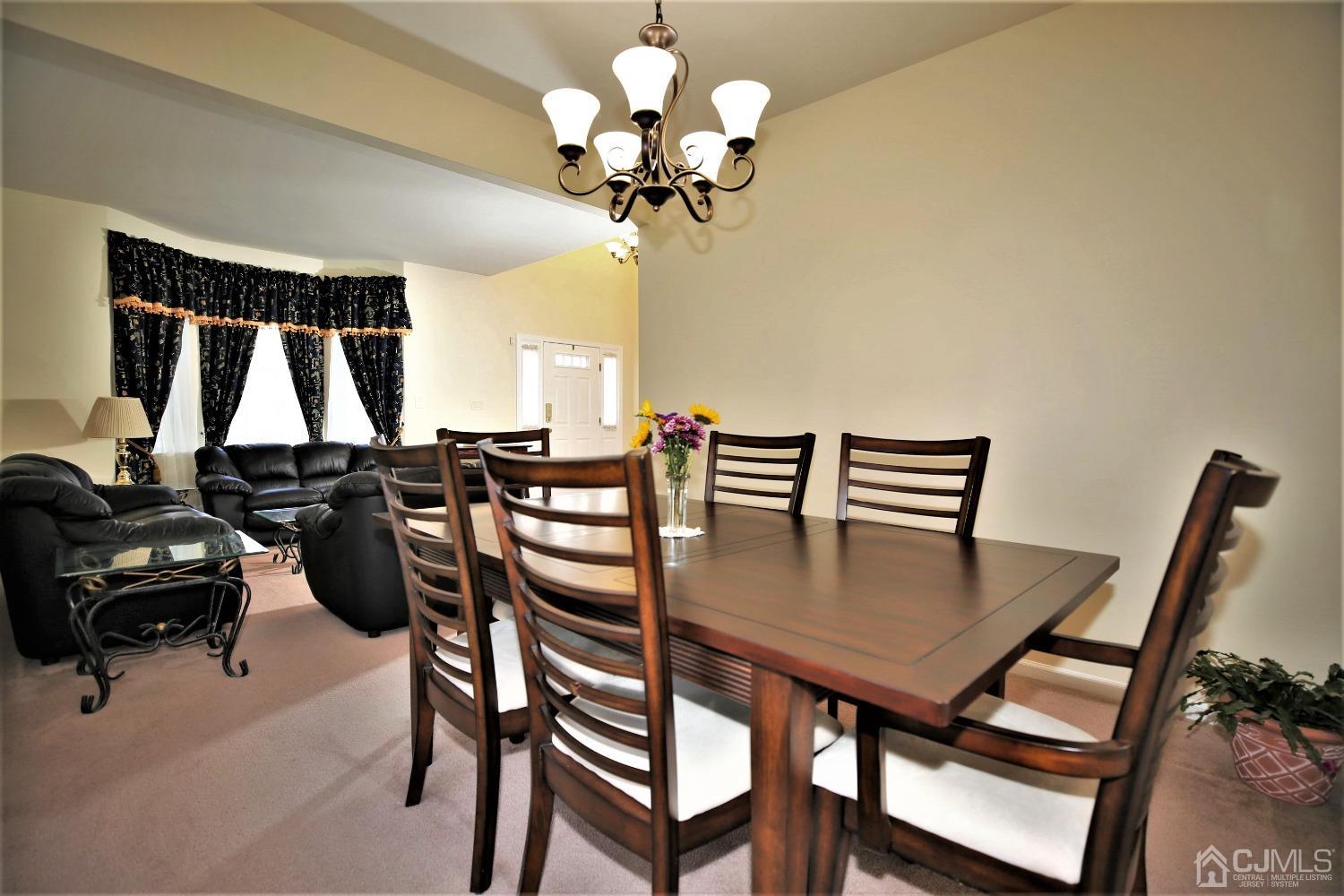 30 Potomac Road Monmouth Junction, NJ 08852 - Photo 11 of 60 a dining room with furniture and a chandelier