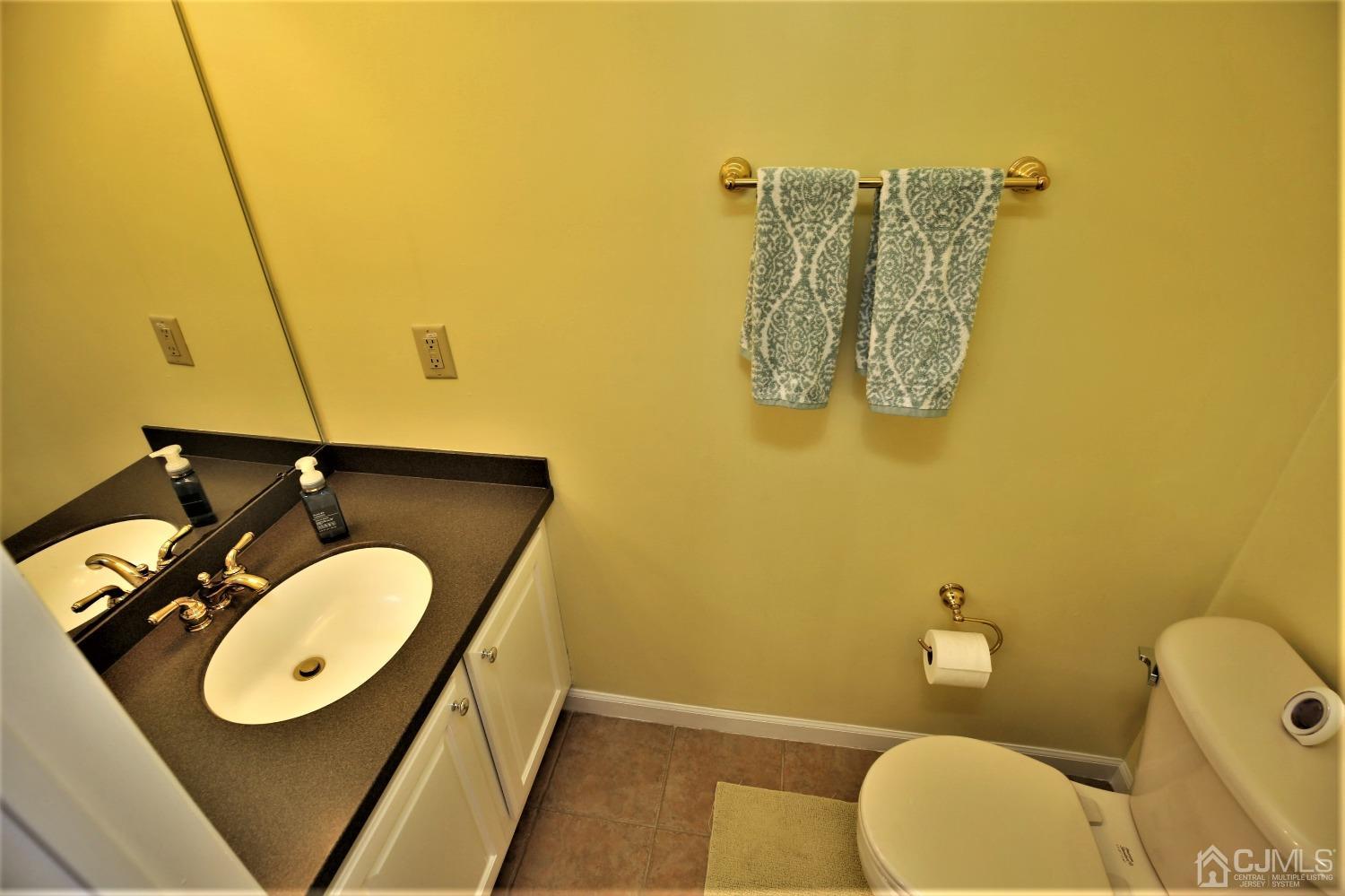 30 Potomac Road Monmouth Junction, NJ 08852 - Photo 27 of 60 a bathroom with a sink mirror vanity and toilet