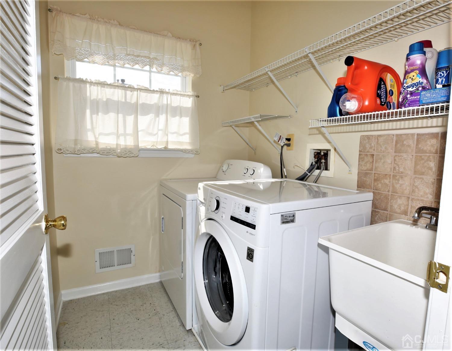 30 Potomac Road Monmouth Junction, NJ 08852 - Photo 28 of 60 a utility room with dryer and washer