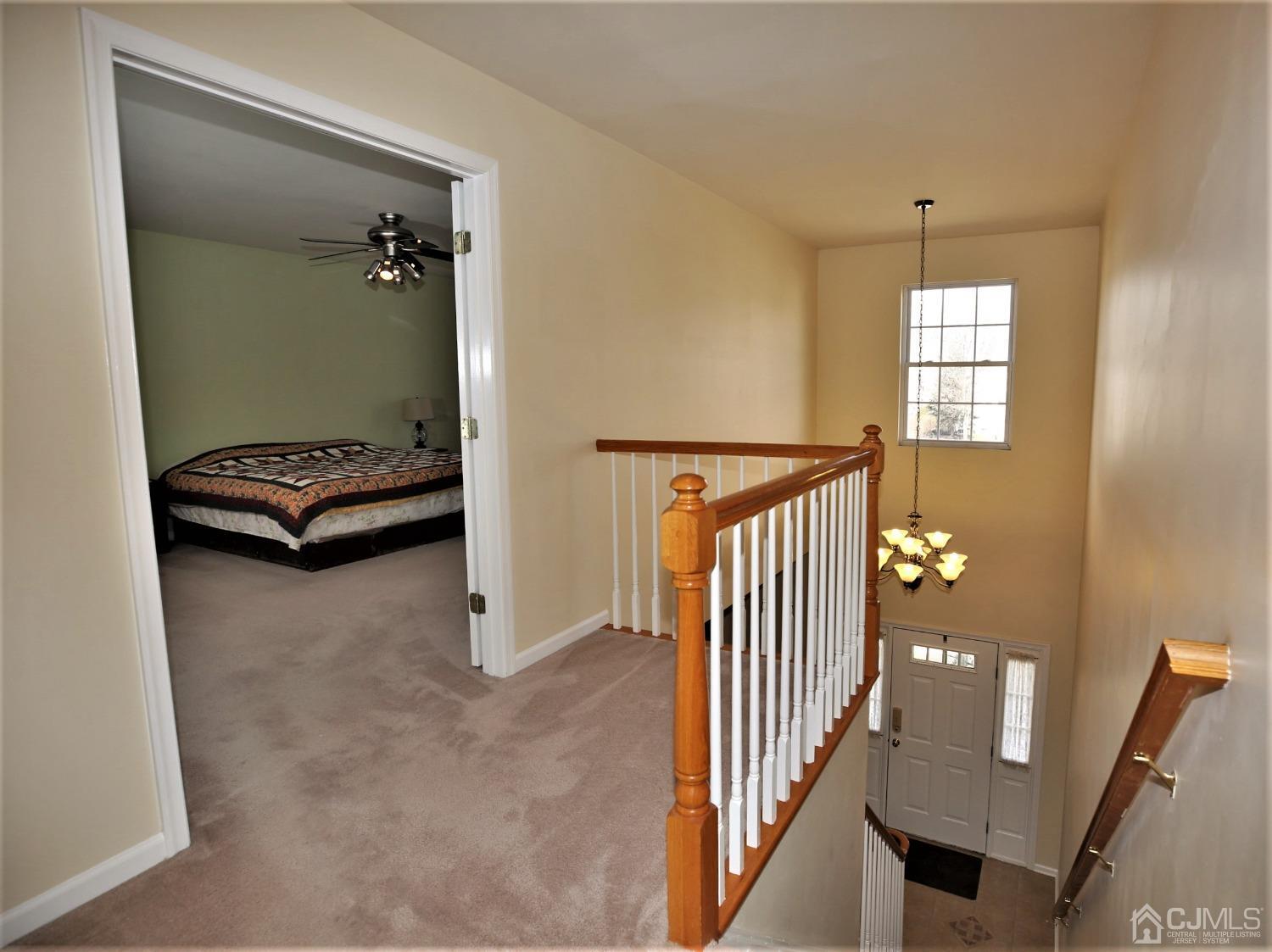 30 Potomac Road Monmouth Junction, NJ 08852 - Photo 30 of 60 a view of a hallway with windows and stairs