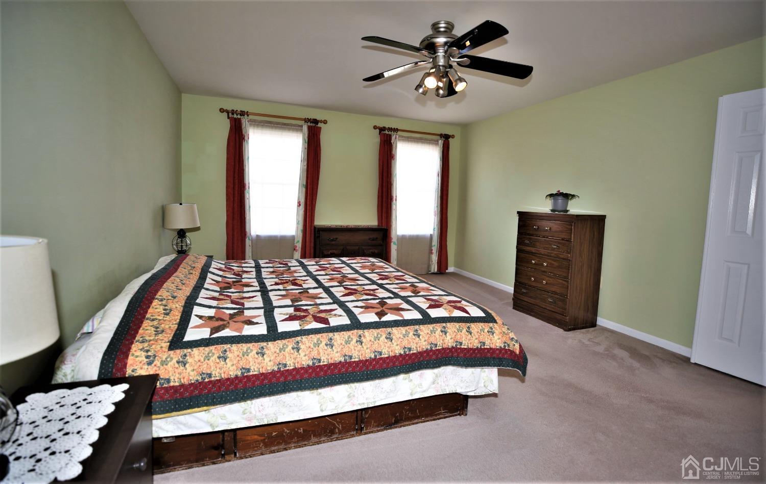 30 Potomac Road Monmouth Junction, NJ 08852 - Photo 33 of 60 a bedroom with a bed lamp and a window