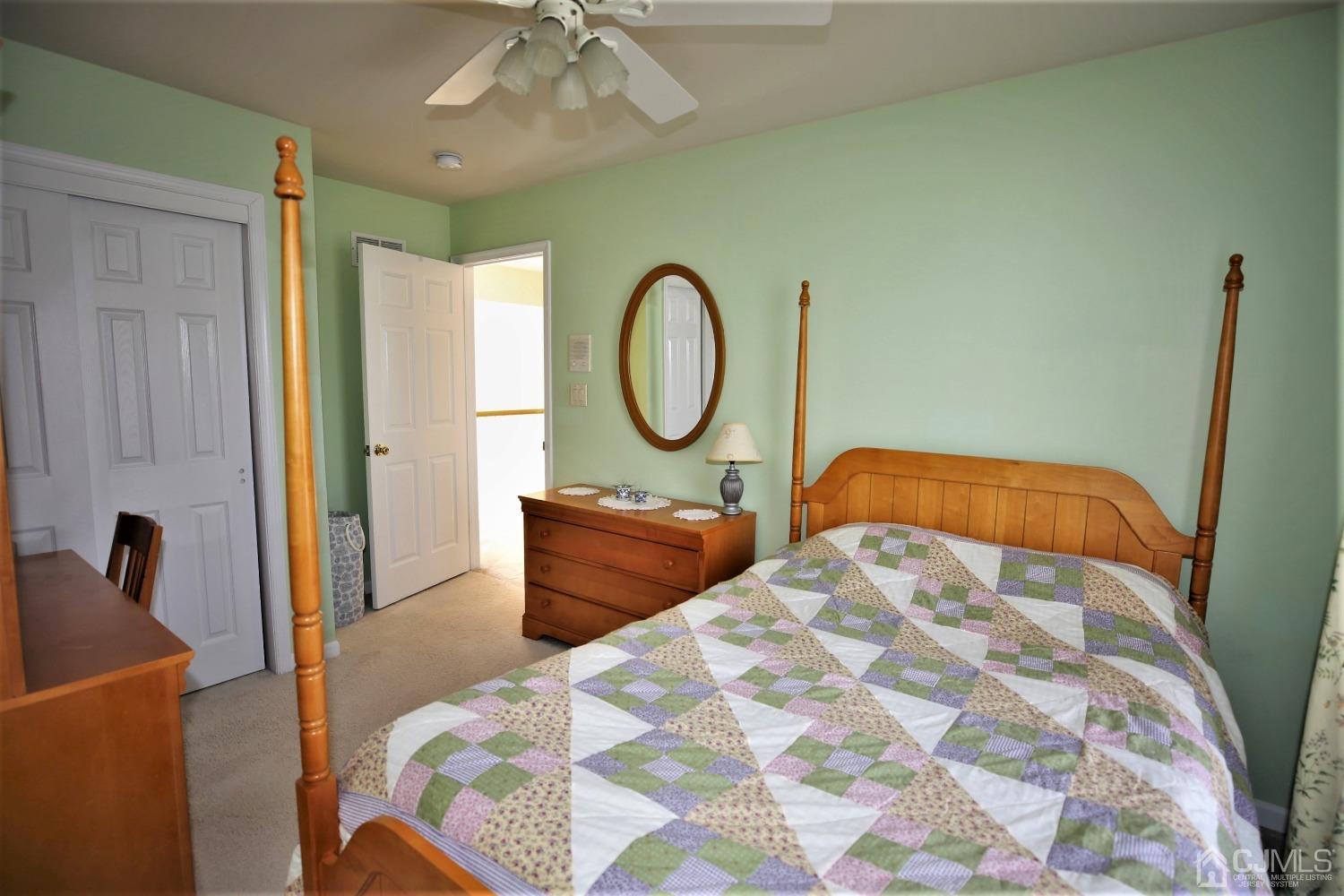 30 Potomac Road Monmouth Junction, NJ 08852 - Photo 39 of 60 a bedroom with a large bed and a chandelier