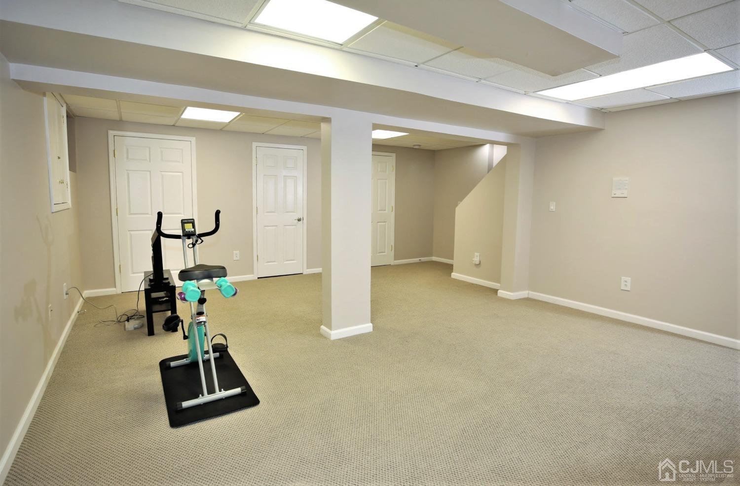 30 Potomac Road Monmouth Junction, NJ 08852 - Photo 46 of 60 a room with gym equipment and a table