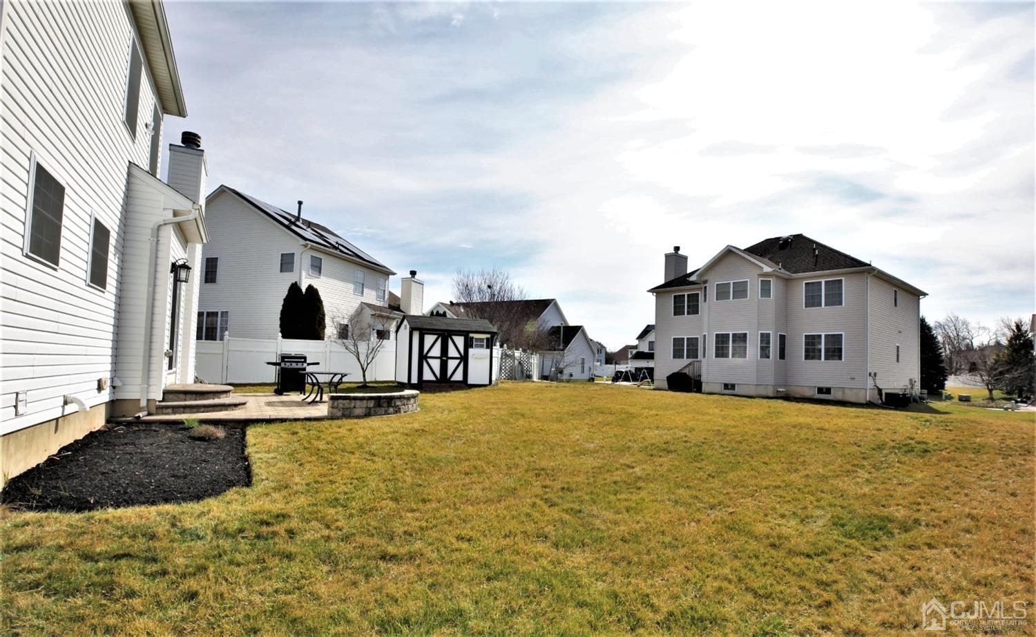 30 Potomac Road Monmouth Junction, NJ 08852 - Photo 59 of 60 a large white building with a large pool in front of it