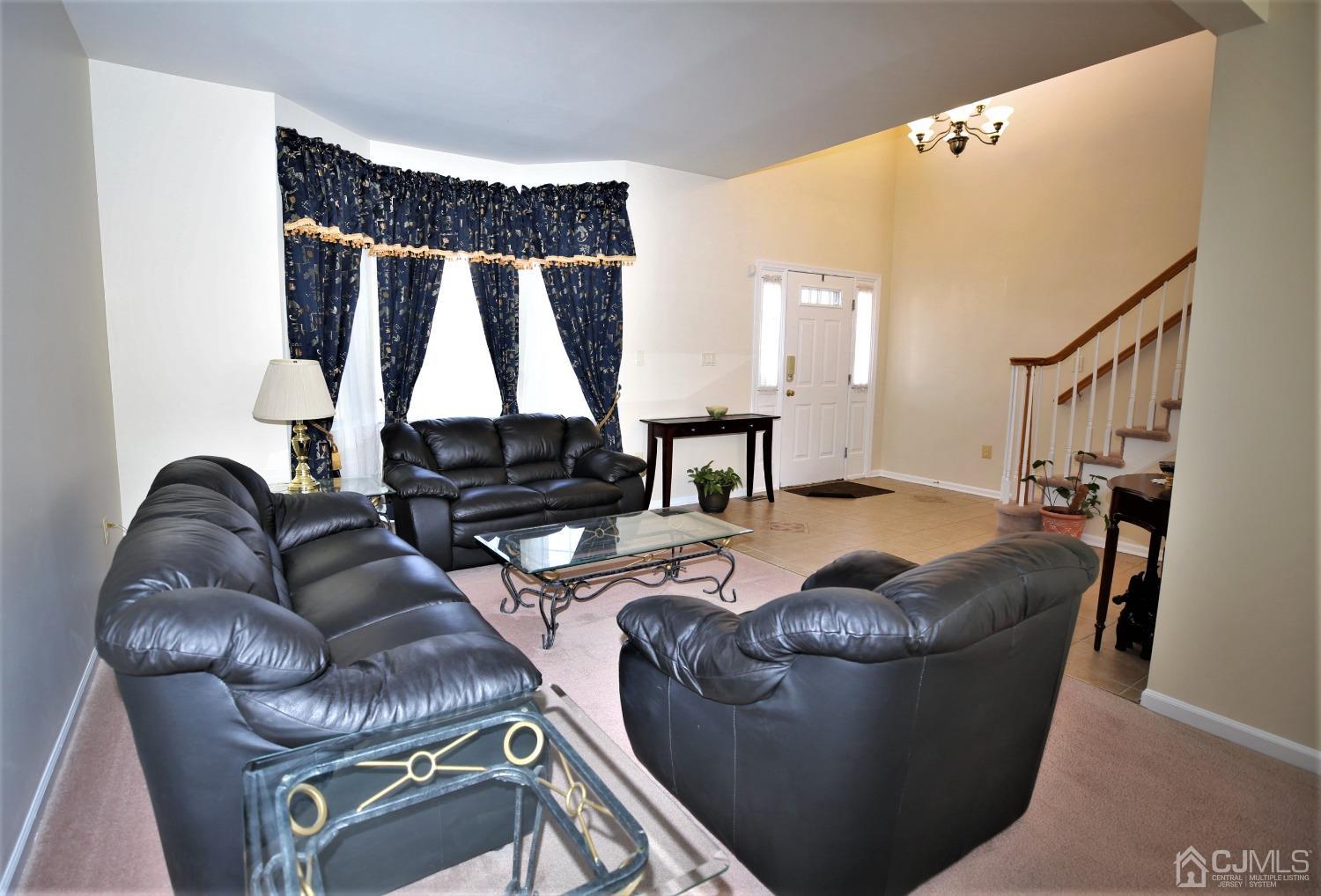 30 Potomac Road Monmouth Junction, NJ 08852 - Photo 6 of 60 a living room with furniture and a large window