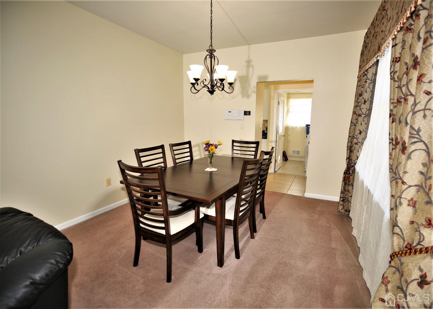 30 Potomac Road Monmouth Junction, NJ 08852 - Photo 8 of 60 a view of a dining room with a table and chairs