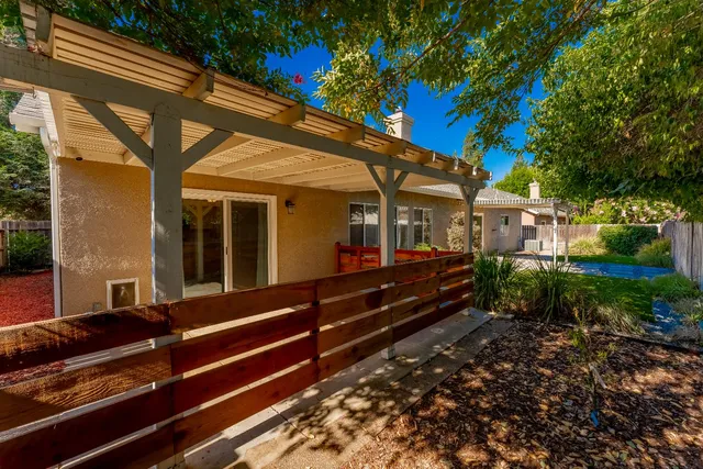 a view of a bench in front of a house